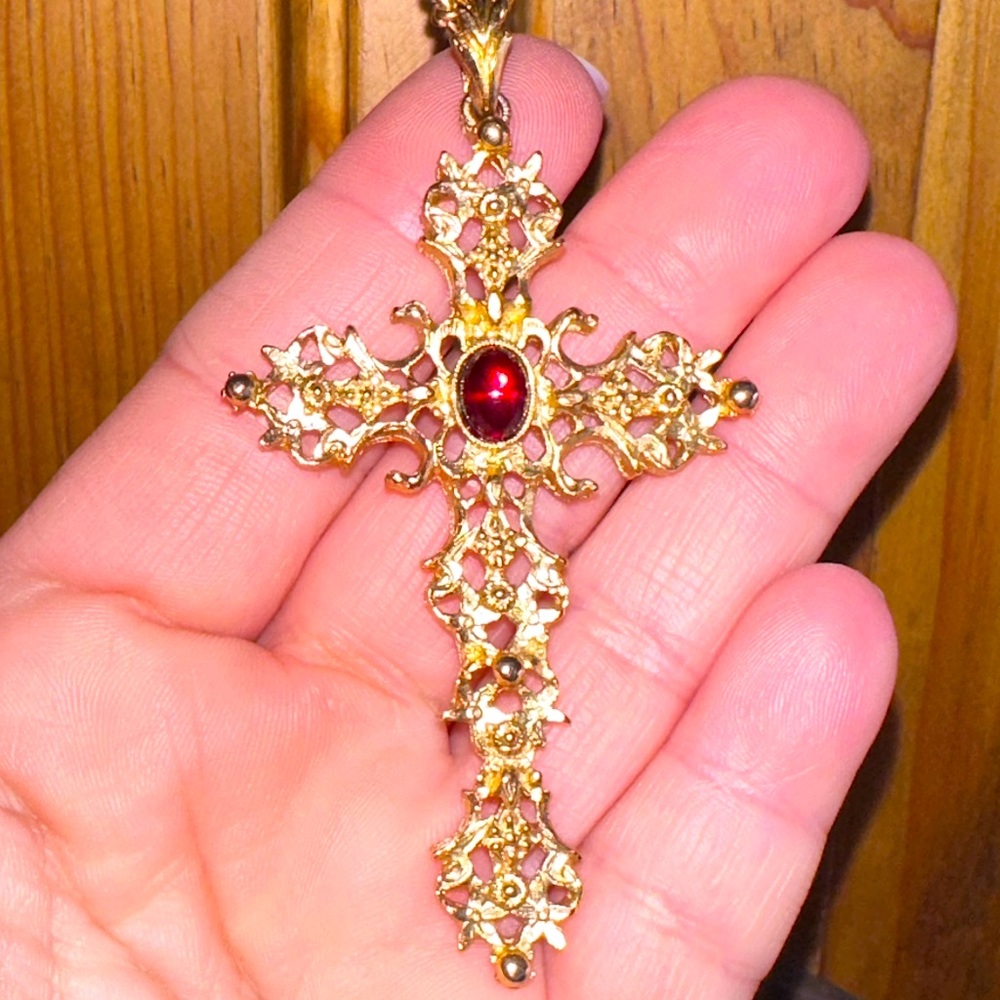 Vintage gold toned cross pendant.